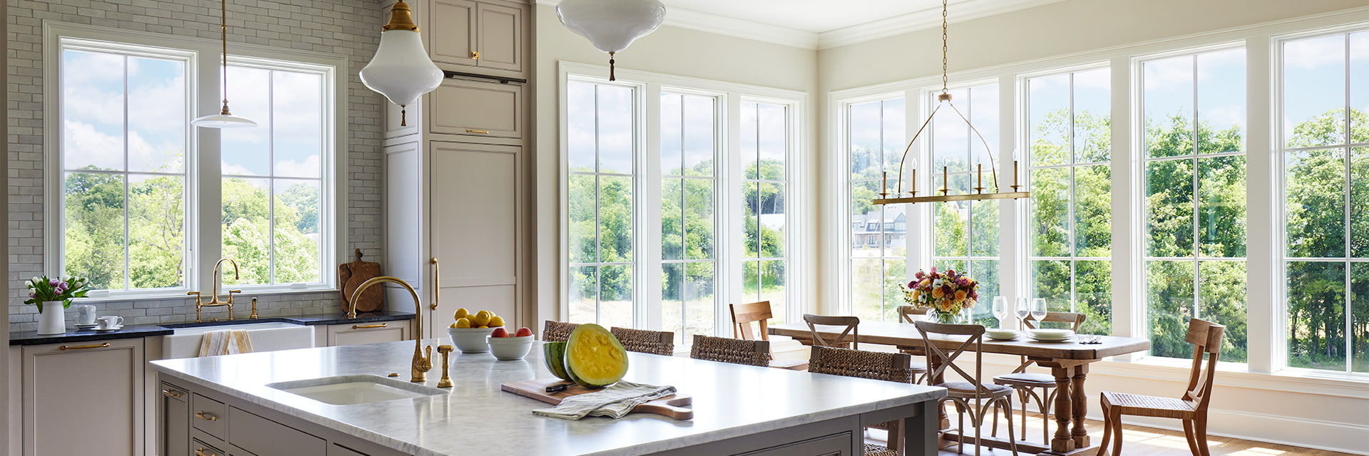 a large set of four arched casement windows over a contemporary bathroom vanity