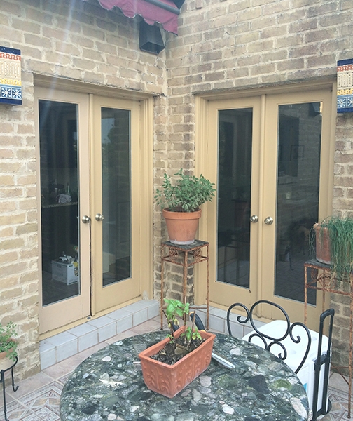 Outdated patio doors on San Antonio home.