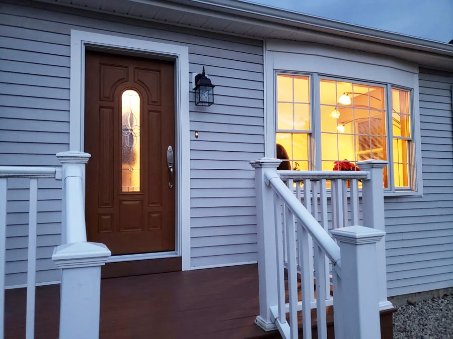 Front door view of an Essex home with a wooden door and newly installed bay window.