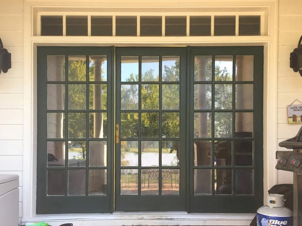 Charles city patio with outdated Green door.