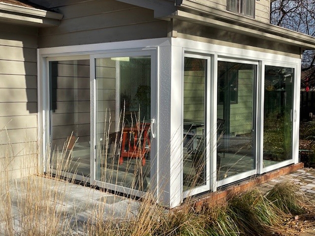 After sunroom sliding patio doors on exterior.
