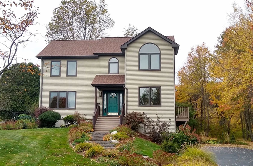 Curbside view of an Amherst home with newly installed windows to cut down on in home condensation.
