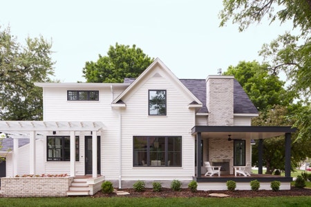 modern farmhouse with black windows and doors