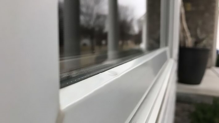 hail damage due to hail on an Omaha home window exterior