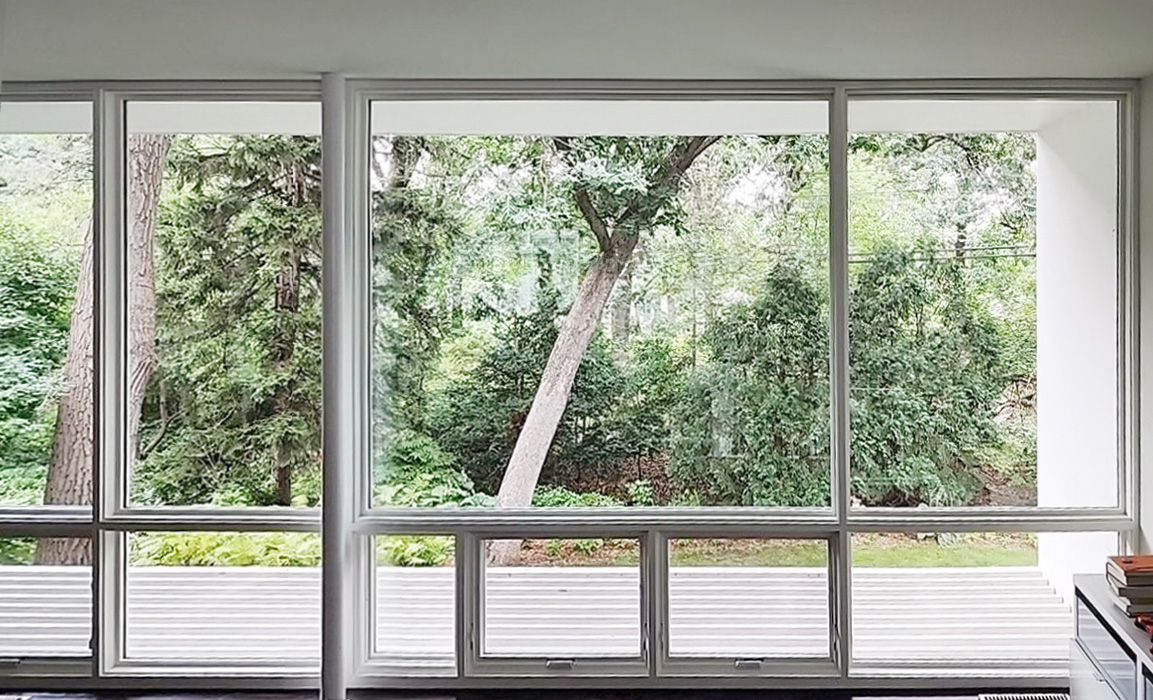 Wall of windows inside modern Falcon Heights home.