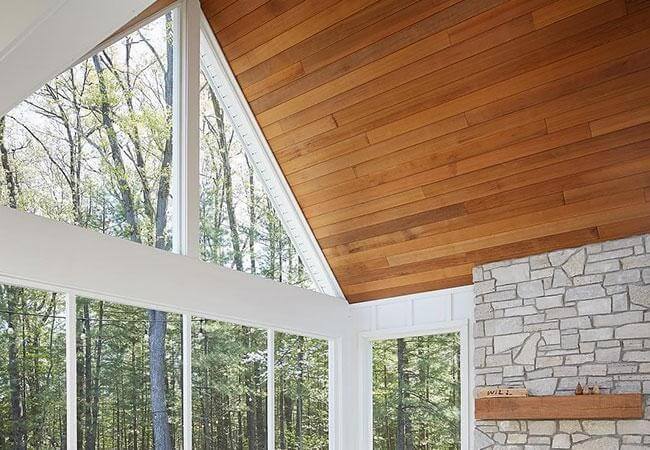 Interior view of large triangle window with white trim