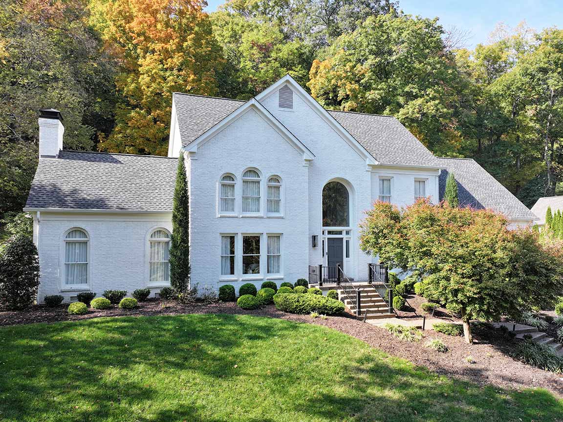 Brentwood home before being refreshed with black windows. 