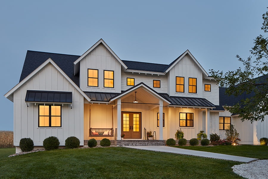 large white farmhouse with cross-style window grilles