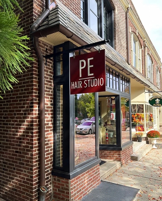 Sideview of PE Hair Studio in historic Haddonfield building with newly installed wooden windows.