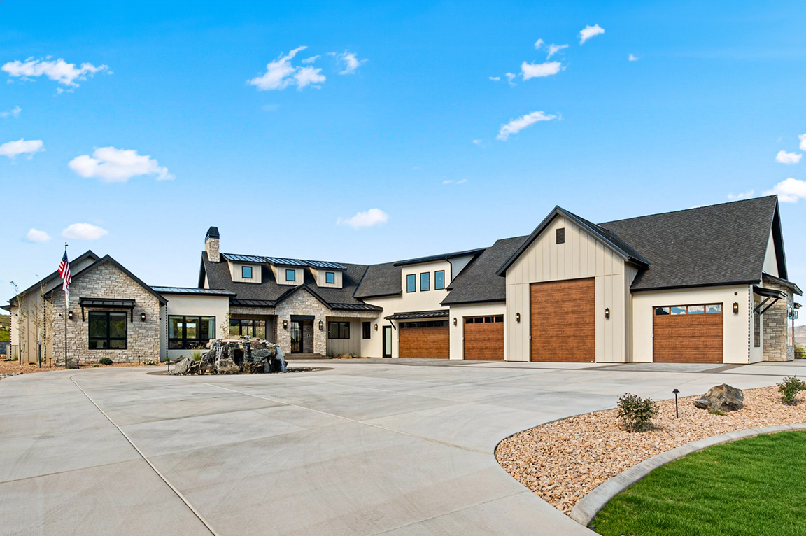 Curbside view of Grand Junction home with newly installed Pella black windows and doors.
