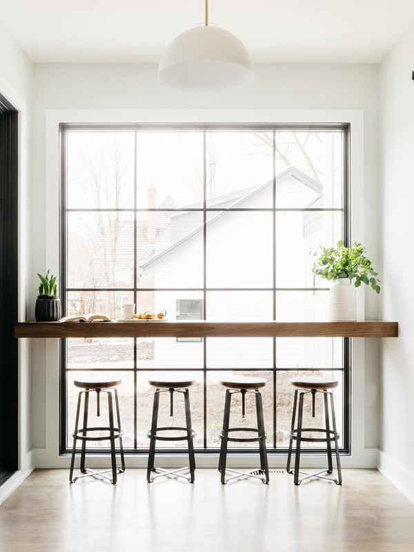 floor to ceiling window kitchen barstools natural light