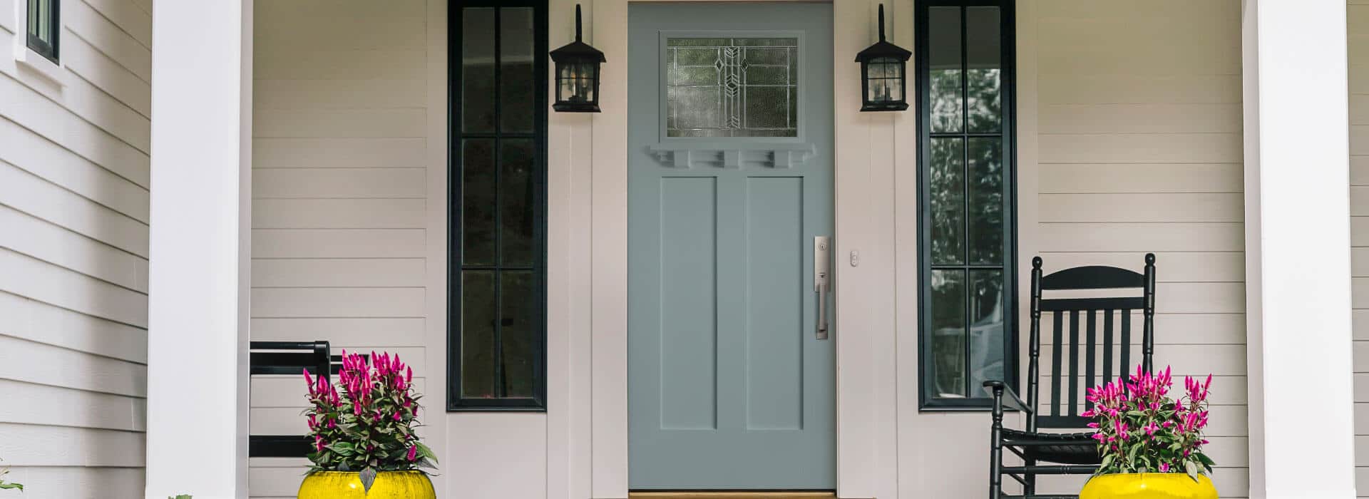 front porch with fiberglass entry door in frost blue and lucas decorative glass