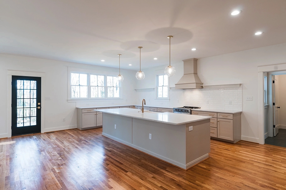 Midlothian kitchen highlighting newly installed white windows and black door.