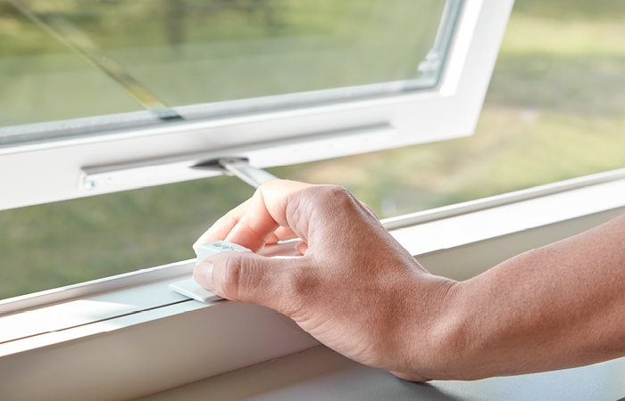 a white impervia awning window with the easy slide operator