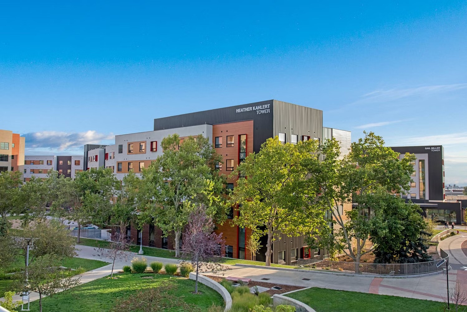 An updated University of Utah dormitory by a large greenery-filled park.