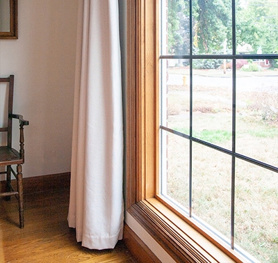 the left side of of a new wood picture window