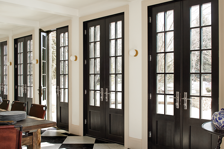 row of french doors with grilles rich dark wood finish