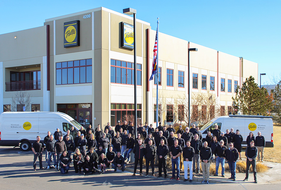 Team members stand together outside of Pella Nashville branch. 