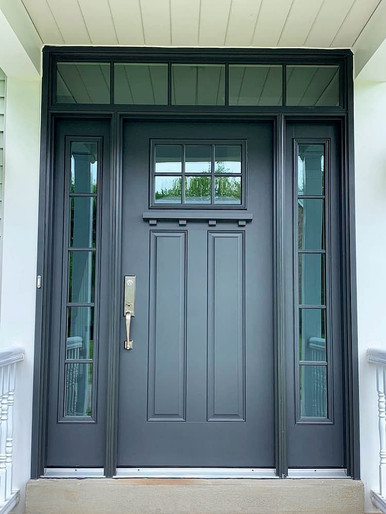 a new black entry door with transom and sidelights