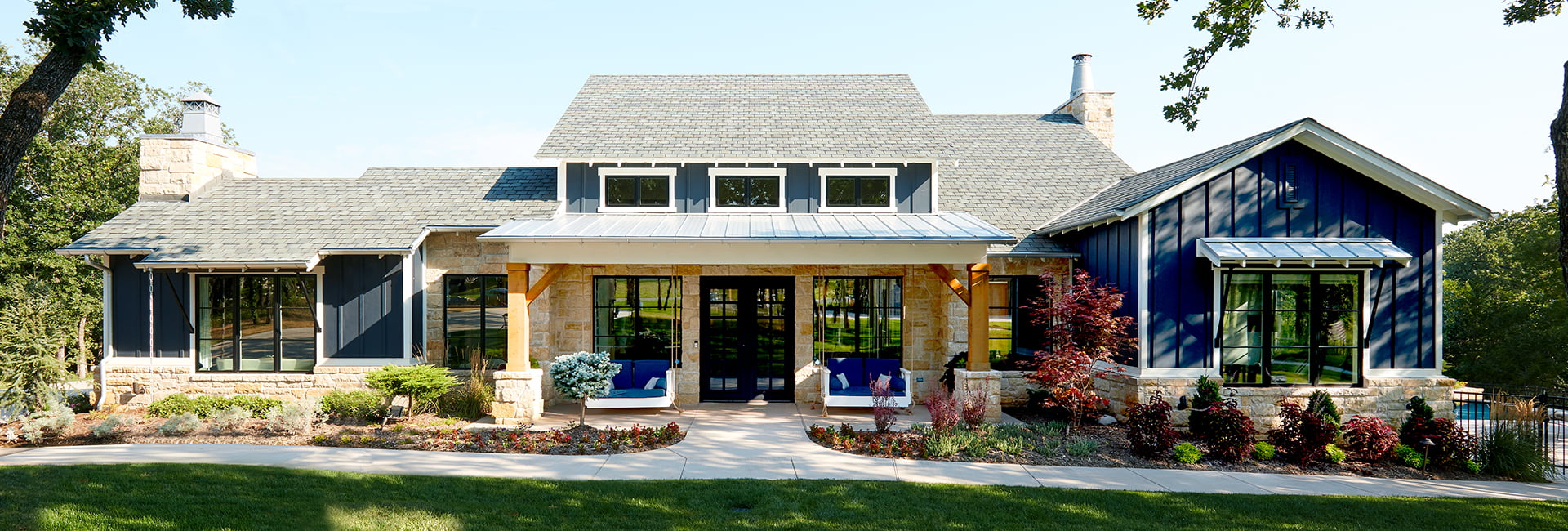 exterior of a new home with brick and siding, and featuring new Lifestyle Series windows