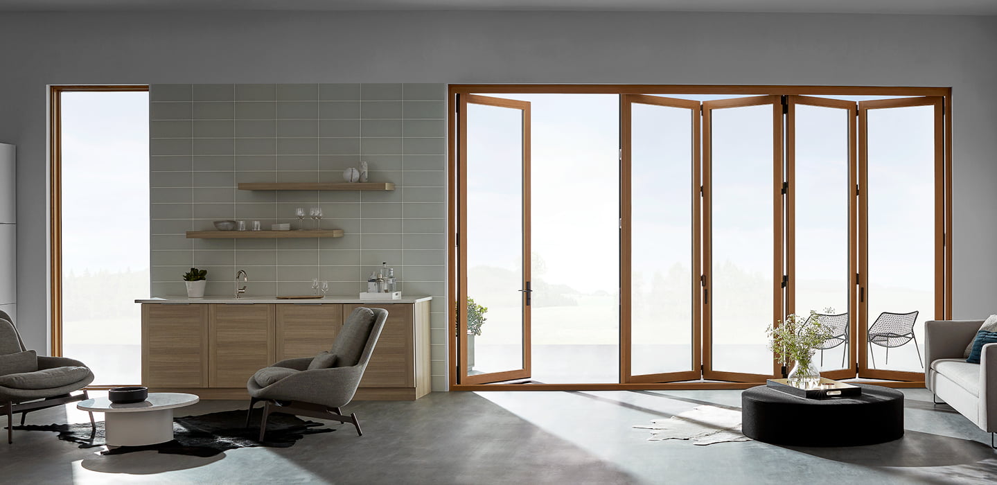 large bifold door opening between the first and second panels from the interior of the home