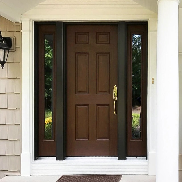 Newly installed Pella woodgrain fiberglass front door on Bedford home.