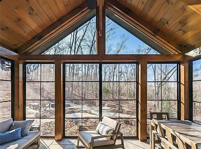 sunroom with floor-to-ceiling windows, including triangle transoms