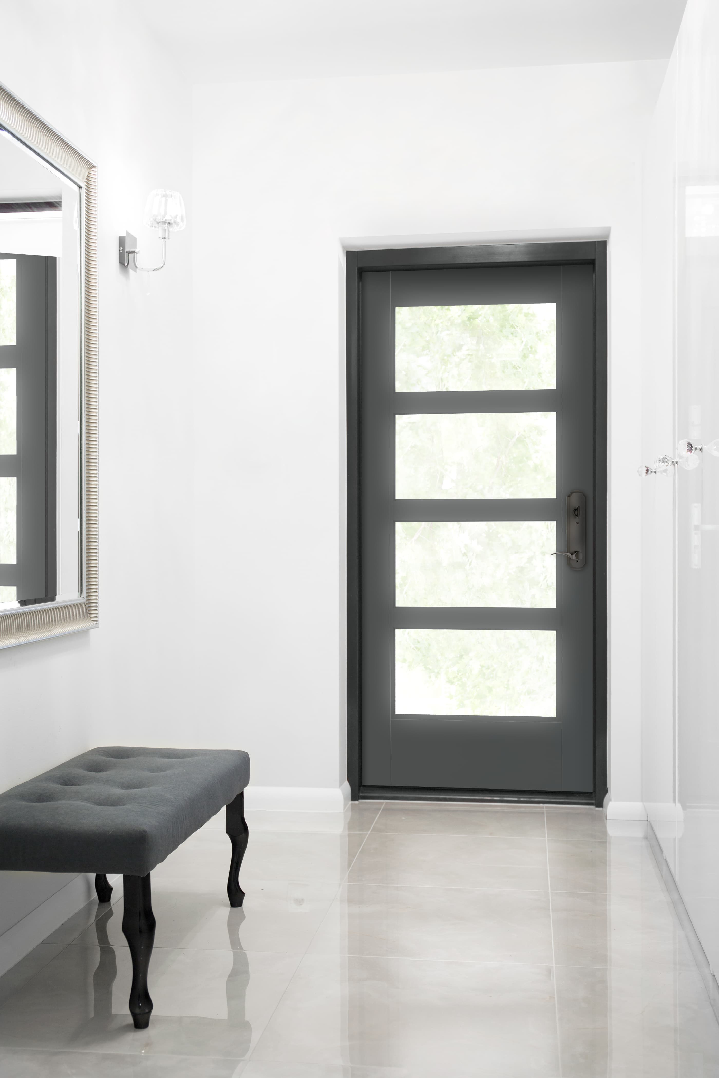 Black front door with glass panels contrasts modern white entryway