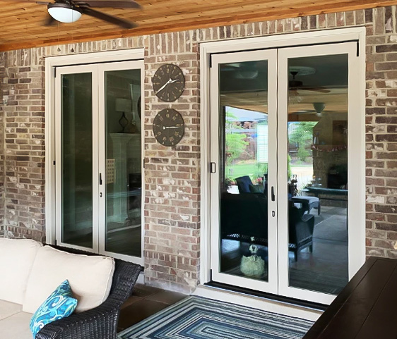 Image of an Arlington covered patio with newly installed bifold patio doors.