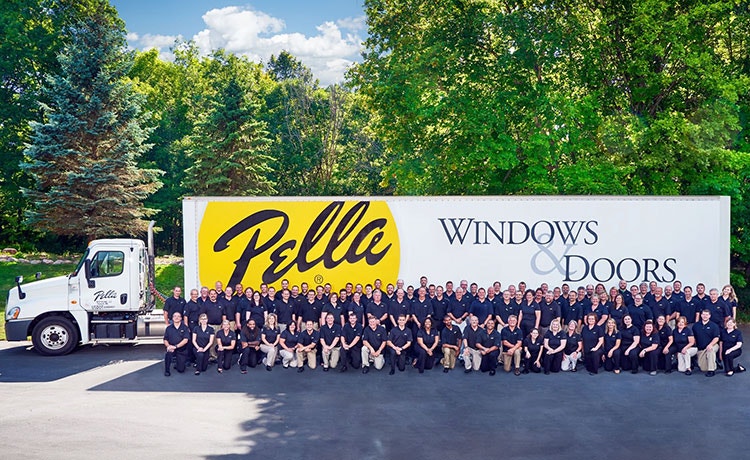 Minnesota's team members all outside in front of a Pella truck. 