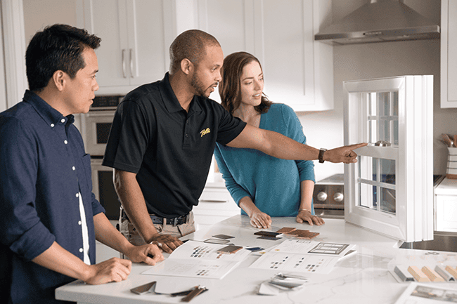 three people looking at window features and options