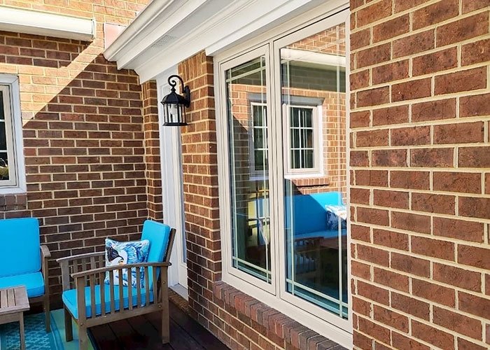 Outside view of tan windows installed in Virginia Beach home.