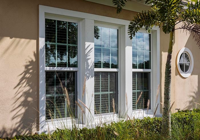 two power remodelers installing fortress windows