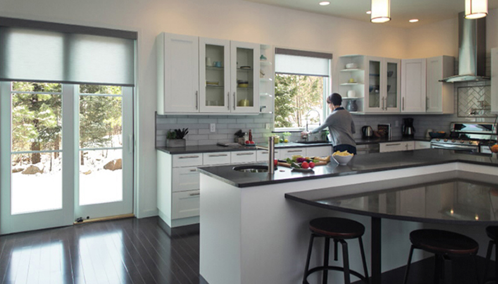 two orange chairs are placed in front of a four-panel french sliding patio door.
