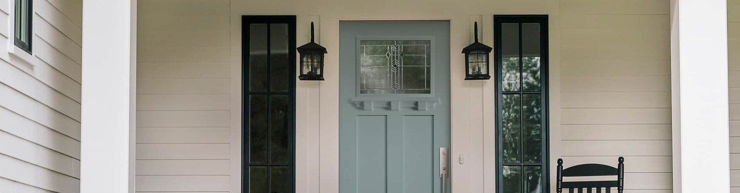 frost blue entry door with dark transoms on each side