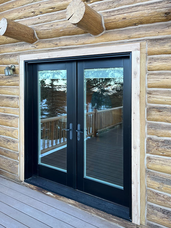 Black double hinged patio doors leading to an outdoor patio in Colorado Springs.