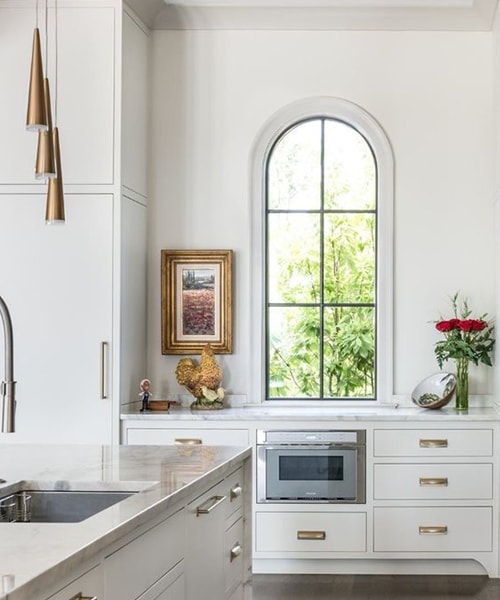 single arched kitchen window in a kitchen over a coffee counter