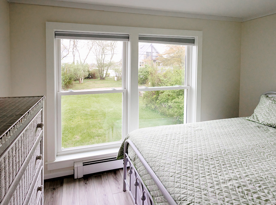 Bedroom in South Kingston home with double-hung vinyl windows.