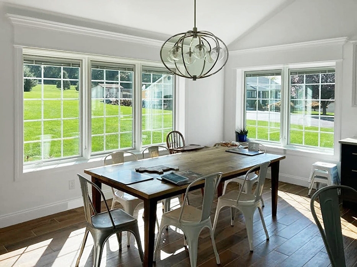 Elevated Etters home addition with new kitchen and dining room windows.