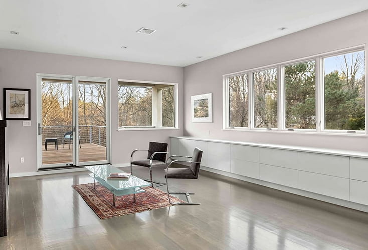Boston home renovation with casement windows, hinged french doors and minimalist furniture.