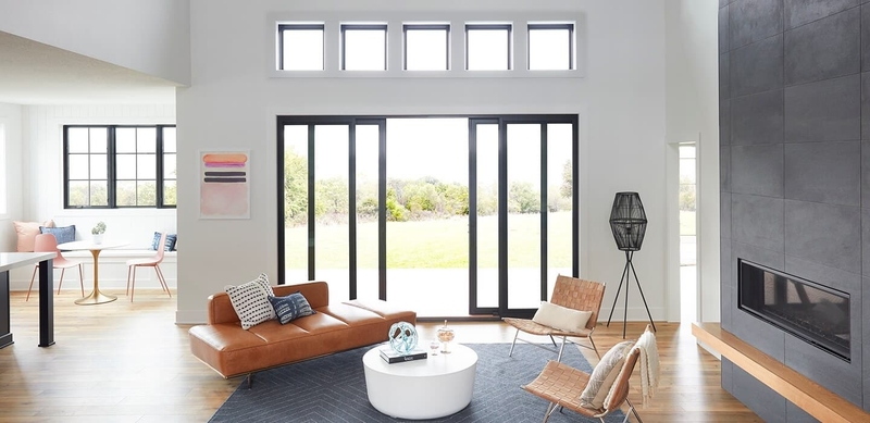 contemporary home with orange accents and black-trimmed sliding doors