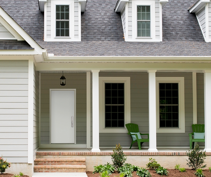 gray home exterior white steel front entry door