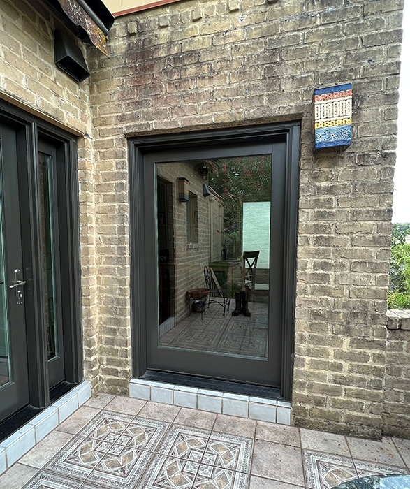 Black exterior Pella patio door on San Antonio home.