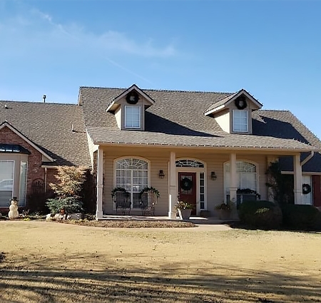 Edmunds, Oklahoma home exterior with outdated white windows