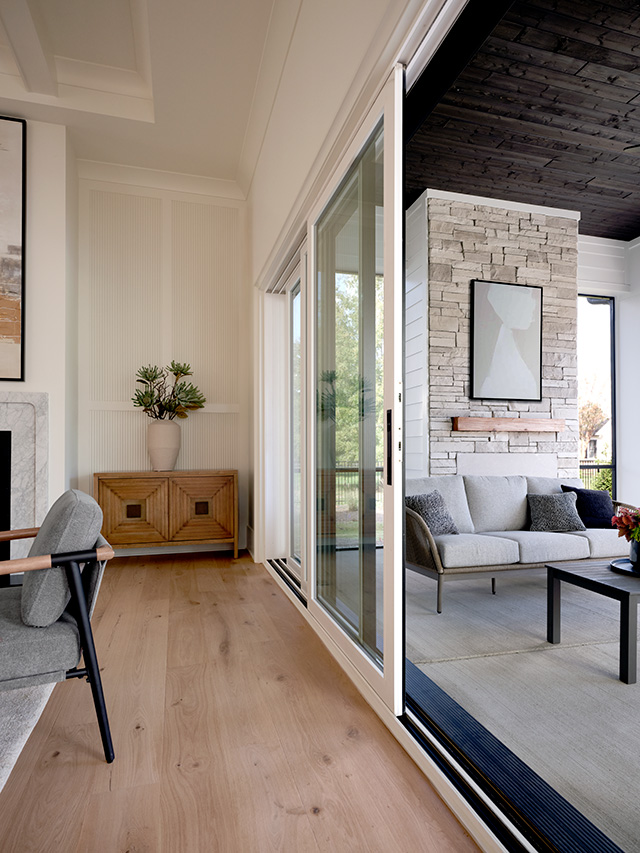 A view of a white multi-slide patio door when standing inline with the door, making it an elongated view.