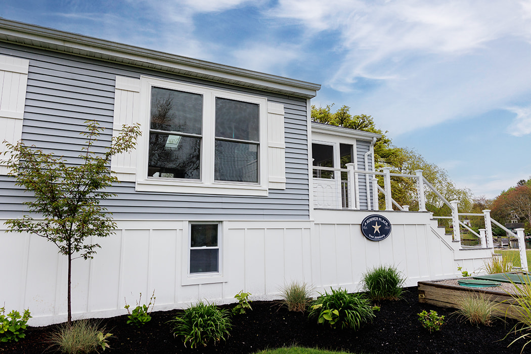 Curbside view of South Kingston home with double-hung vinyl windows.