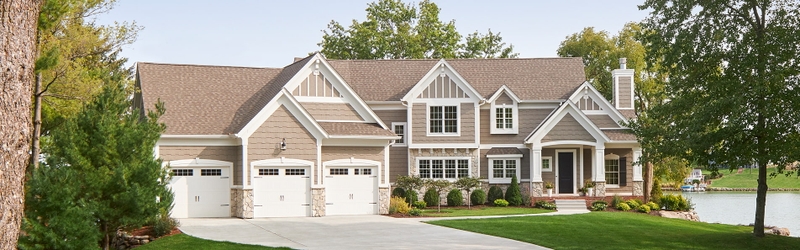large traditional home with lifestyle series windows