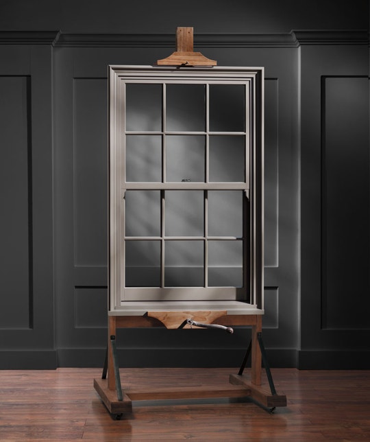 a single pella reserve double-hung window on a display stand