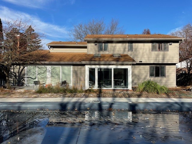 After sliding glass doors overlooking pool. 