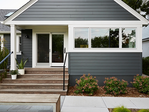 Curbside view of mid-century modern home in Minnesota home with newly installed Pella wood windows and patio door.